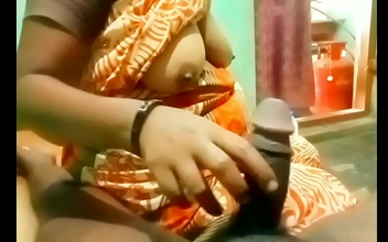 Indulge in the Sensuous Touch of a Sexy Aunty's Handjob as She Takes Control of Your Throbbing Maleness - Exclusive!